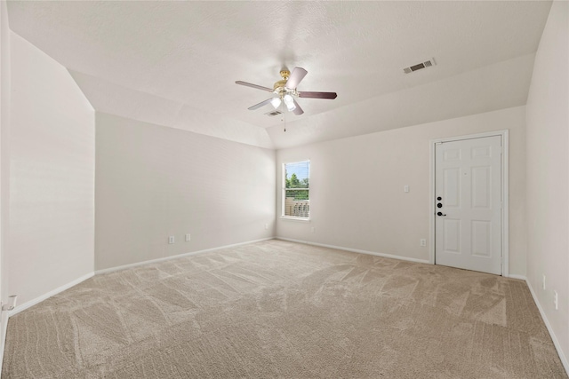 empty room with ceiling fan, baseboards, light carpet, and visible vents