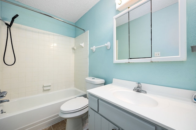 full bath featuring bathing tub / shower combination, vanity, a textured ceiling, and toilet