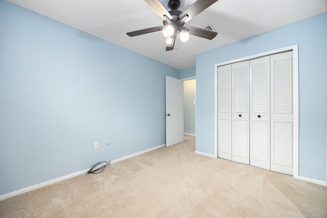 19302 Peach Valley Cir, Houston, TX 77084 - unfurnished bedroom with carpet, baseboards, a closet, a textured ceiling, and a ceiling fan