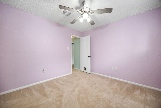 19302 Peach Valley Cir, Houston, TX 77084 - unfurnished room with ceiling fan, light colored carpet, a textured ceiling, and baseboards