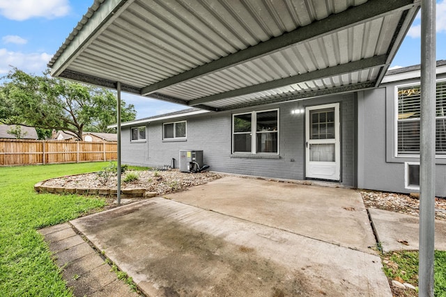 19302 Peach Valley Cir, Houston, TX 77084 - rear view of house featuring cooling unit, a patio, and brick siding