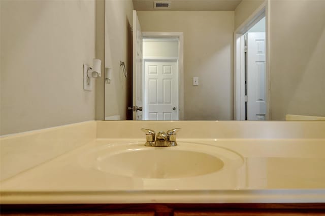 bathroom featuring visible vents and vanity