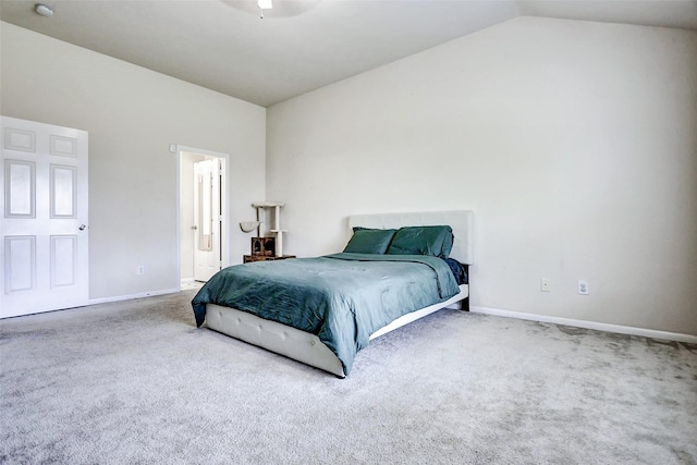 bedroom with carpet flooring, baseboards, and vaulted ceiling