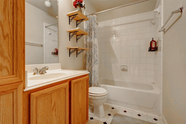 full bath featuring vanity, toilet, tile patterned flooring, and shower / tub combo