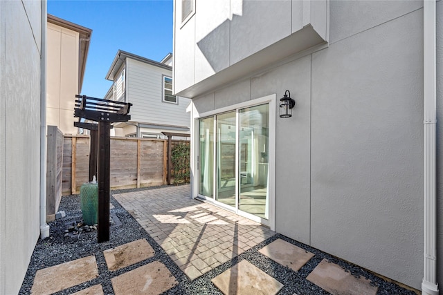 view of patio / terrace with fence and a pergola