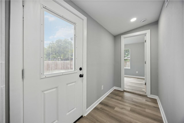 6810 Cohn St, Houston, TX 77091 - doorway with vaulted ceiling, baseboards, and dark wood-style floors