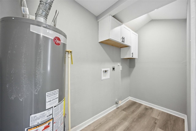 6810 Cohn St, Houston, TX 77091 - washroom with hookup for an electric dryer, water heater, cabinet space, light wood finished floors, and baseboards