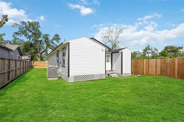 6810 Cohn St, Houston, TX 77091 - view of outdoor structure with a fenced backyard, cooling unit, and entry steps