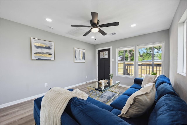 6810 Cohn St, Houston, TX 77091 - living area featuring ceiling fan, baseboards, visible vents, and light wood-style flooring
