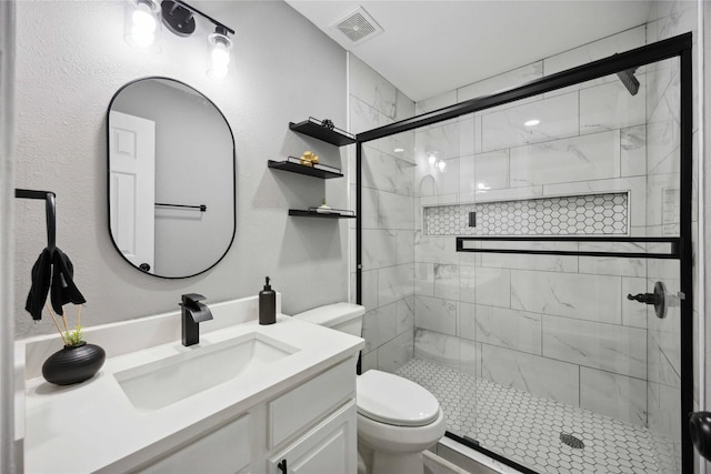 6810 Cohn St, Houston, TX 77091 - bathroom with a shower stall, visible vents, toilet, and vanity
