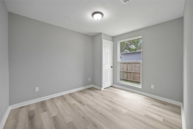 6810 Cohn St, Houston, TX 77091 - spare room with baseboards and wood finished floors