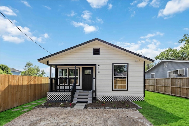 6810 Cohn St, Houston, TX 77091 - view of front of home with a porch, a fenced backyard, and a front yard
