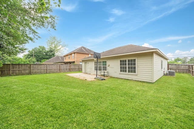 back of house with cooling unit, a lawn, a patio, and a fenced backyard