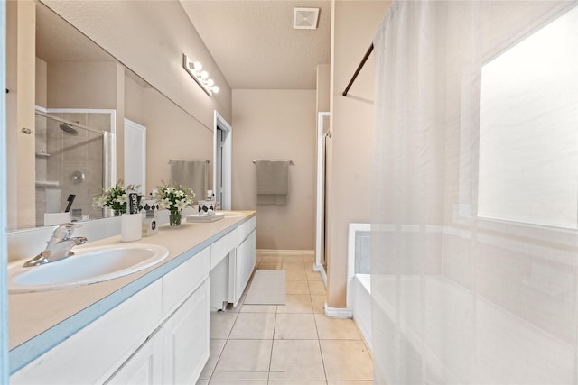 bathroom with tile patterned floors, visible vents, a shower stall, and a sink