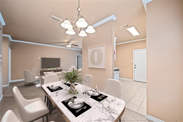 dining area with light tile patterned flooring, visible vents, and crown molding