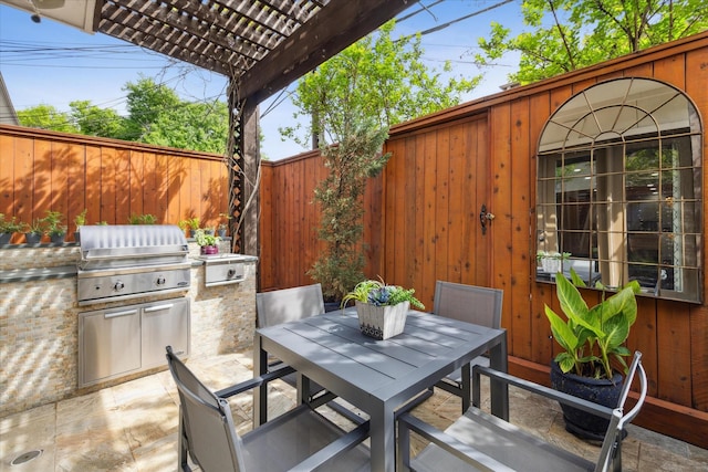 5021 Augusta St, Houston, TX 77007 - view of patio / terrace with a pergola, outdoor dining space, a fenced backyard, exterior kitchen, and area for grilling