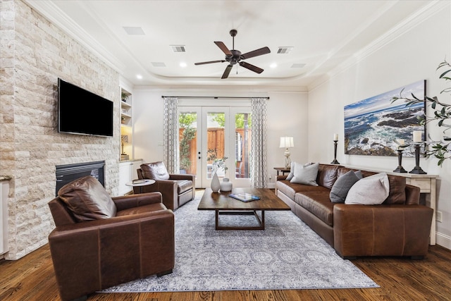 5021 Augusta St, Houston, TX 77007 - living area with ornamental molding, a fireplace, ceiling fan, and wood-type flooring