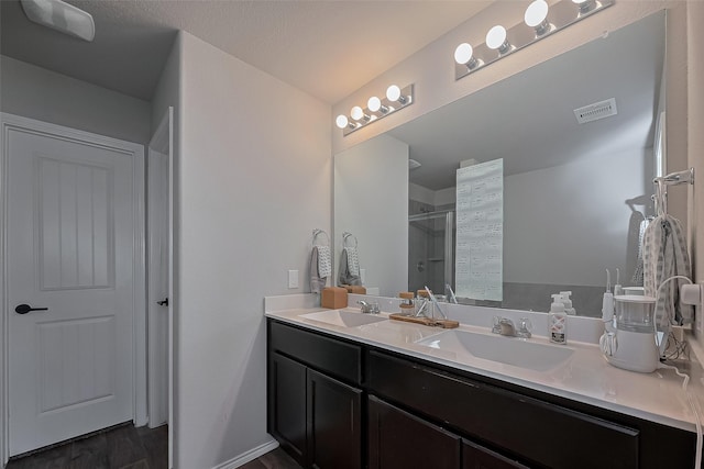 515 Green Clover Ln, Rosharon, TX 77583 - full bath featuring double vanity, visible vents, a stall shower, and a sink