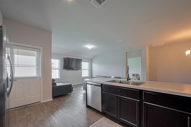 515 Green Clover Ln, Rosharon, TX 77583 - kitchen featuring stainless steel appliances, wood finished floors, visible vents, a sink, and open floor plan