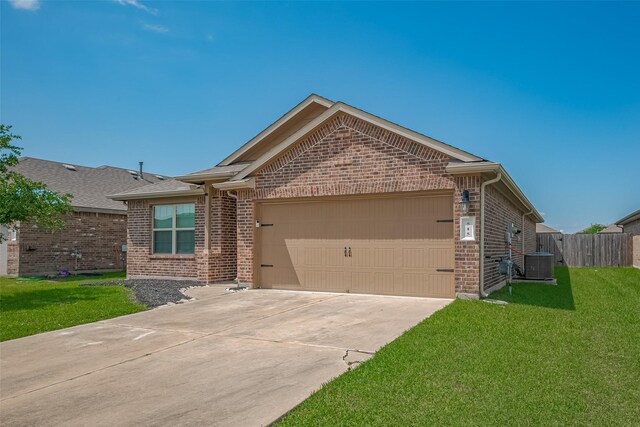 515 Green Clover Ln, Rosharon, TX 77583 - ranch-style home with a front lawn, brick siding, driveway, and a garage