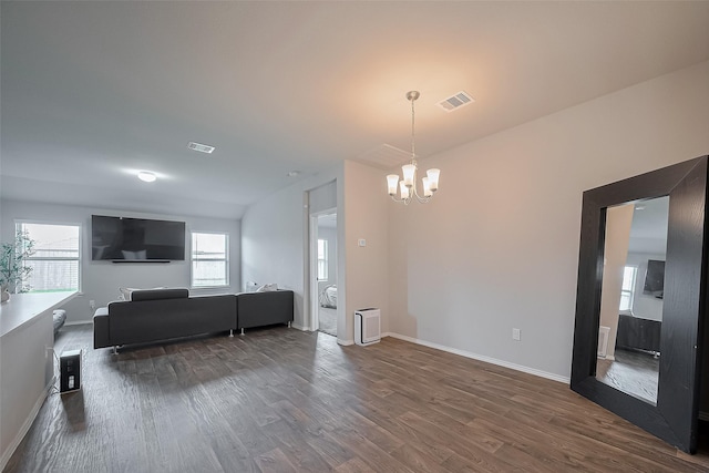 515 Green Clover Ln, Rosharon, TX 77583 - living room featuring baseboards, visible vents, a chandelier, and dark wood finished floors