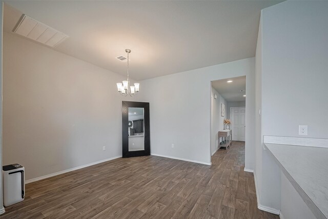 515 Green Clover Ln, Rosharon, TX 77583 - unfurnished dining area featuring a chandelier, baseboards, visible vents, and dark wood-style floors