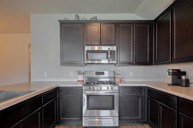 515 Green Clover Ln, Rosharon, TX 77583 - kitchen featuring light countertops, appliances with stainless steel finishes, and light wood-style flooring