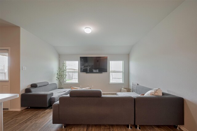 515 Green Clover Ln, Rosharon, TX 77583 - living area featuring baseboards, vaulted ceiling, and wood finished floors