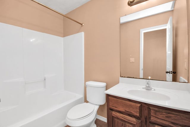 full bath featuring tub / shower combination, toilet, and vanity
