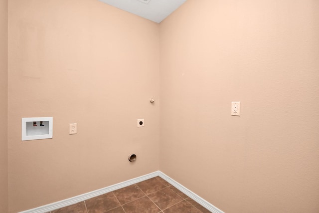 laundry room featuring hookup for an electric dryer, baseboards, washer hookup, dark tile patterned flooring, and laundry area
