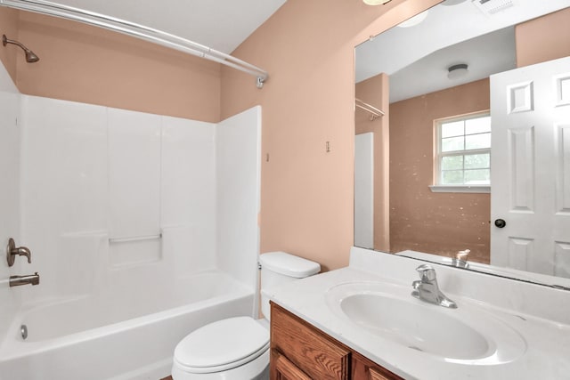 bathroom featuring visible vents, toilet, vanity, and bathing tub / shower combination