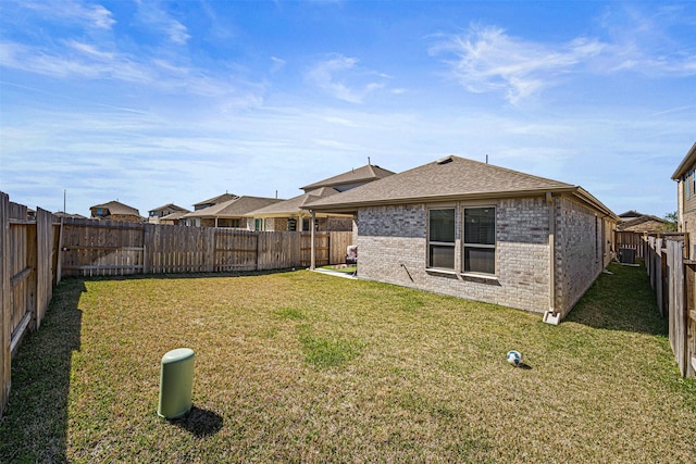 view of yard with a fenced backyard