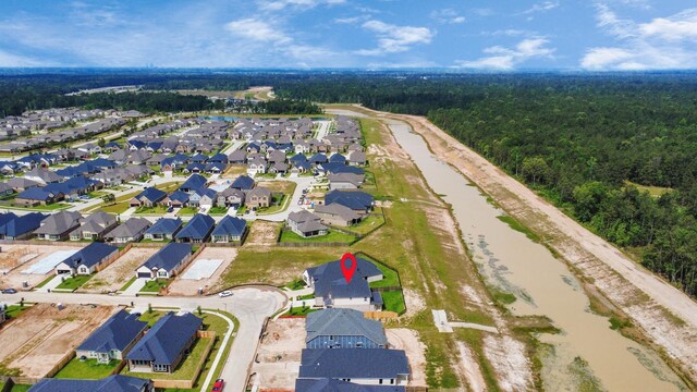 15607 Boulder Lake Ln, Conroe, TX 77302 - birds eye view of property featuring a forest view and a residential view