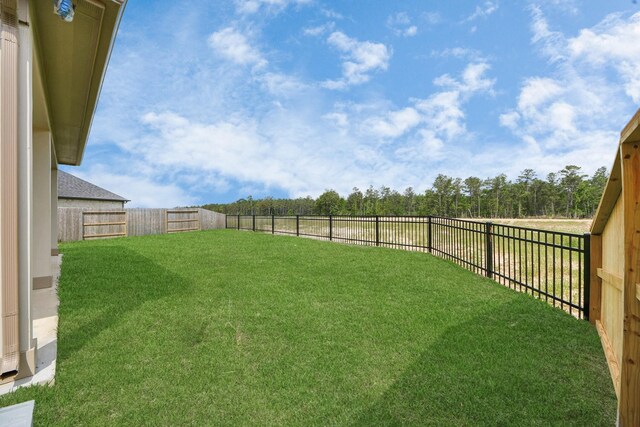 15607 Boulder Lake Ln, Conroe, TX 77302 - view of yard featuring a fenced backyard