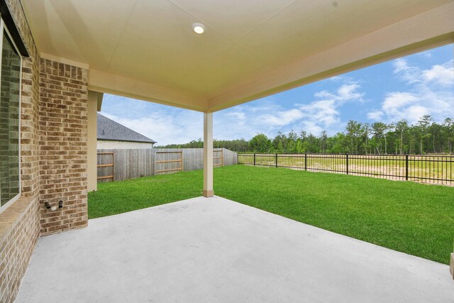 15607 Boulder Lake Ln, Conroe, TX 77302 - view of patio with a fenced backyard