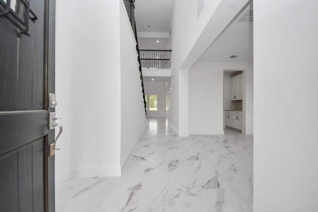 15607 Boulder Lake Ln, Conroe, TX 77302 - entrance foyer featuring baseboards and marble finish floor