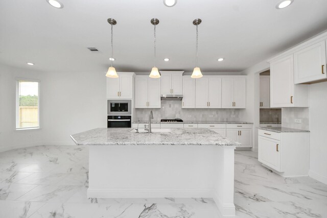 15607 Boulder Lake Ln, Conroe, TX 77302 - kitchen featuring a sink, stainless steel appliances, marble finish floor, recessed lighting, and white cabinets