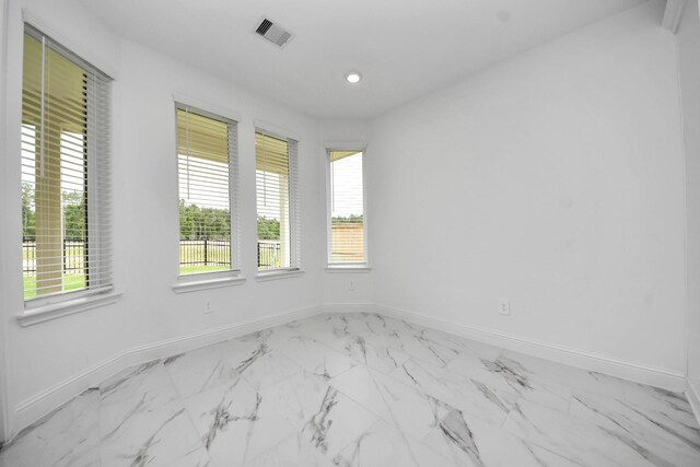 15607 Boulder Lake Ln, Conroe, TX 77302 - spare room featuring marble finish floor, visible vents, baseboards, and recessed lighting