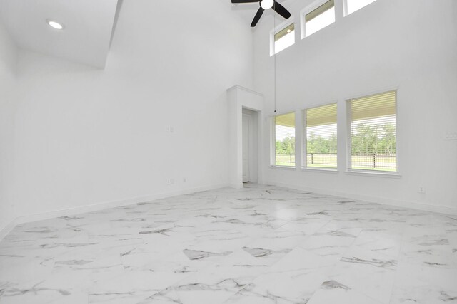 15607 Boulder Lake Ln, Conroe, TX 77302 - unfurnished room featuring baseboards, a wealth of natural light, and ceiling fan