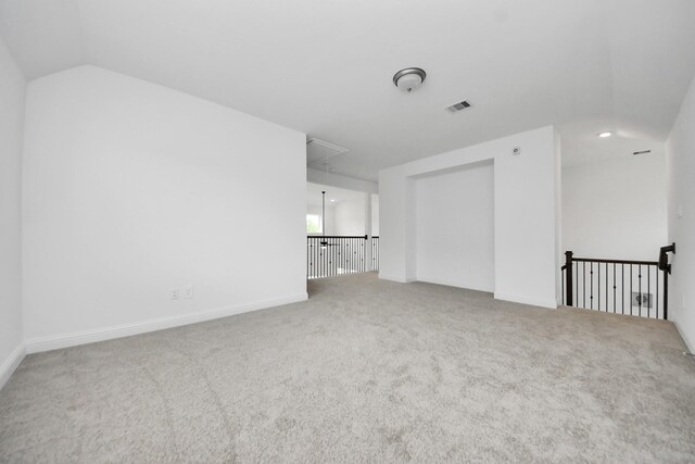 15607 Boulder Lake Ln, Conroe, TX 77302 - interior space featuring attic access, vaulted ceiling, visible vents, and carpet floors