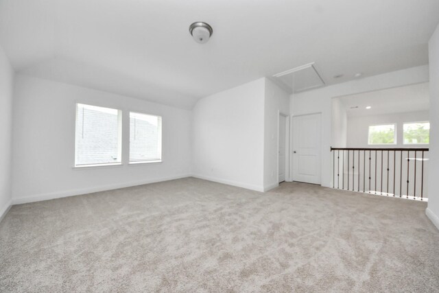 15607 Boulder Lake Ln, Conroe, TX 77302 - carpeted empty room with attic access and baseboards