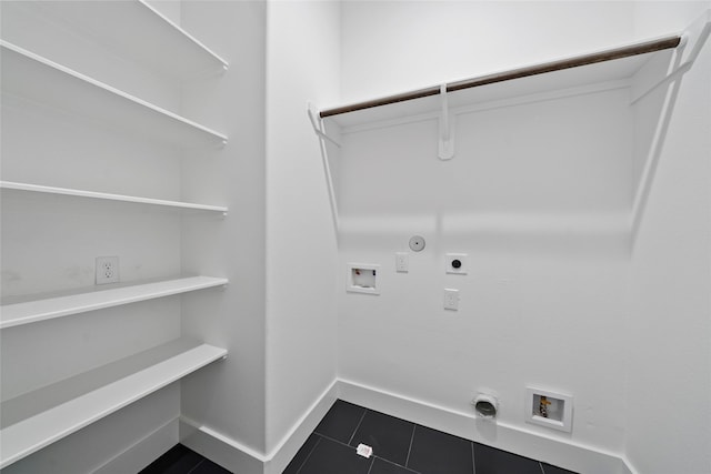 4519 Teton St, Houston, TX 77051 - laundry room with hookup for a washing machine, electric dryer hookup, gas dryer hookup, dark tile patterned floors, and laundry area