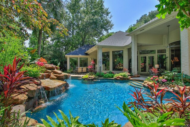 17511 Seidel Rd, Tomball, TX 77377 - outdoor pool with french doors and a patio