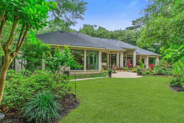 17511 Seidel Rd, Tomball, TX 77377 - rear view of property with a yard, a patio area, and roof with shingles