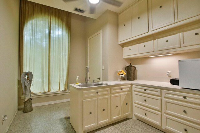 17511 Seidel Rd, Tomball, TX 77377 - kitchen with a sink, visible vents, baseboards, a ceiling fan, and light countertops