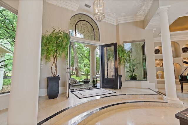 17511 Seidel Rd, Tomball, TX 77377 - entrance foyer featuring a towering ceiling, ornate columns, visible vents, ornamental molding, and baseboards