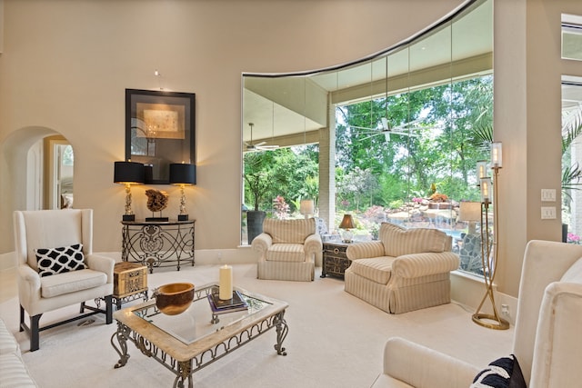 17511 Seidel Rd, Tomball, TX 77377 - carpeted living room with arched walkways and a healthy amount of sunlight