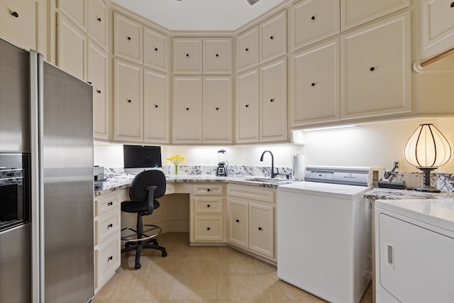 17511 Seidel Rd, Tomball, TX 77377 - clothes washing area with light tile patterned floors, separate washer and dryer, and a sink