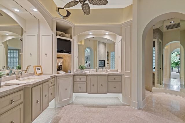 17511 Seidel Rd, Tomball, TX 77377 - full bath featuring two vanities, ceiling fan, and a sink