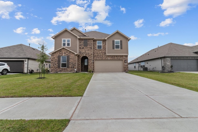traditional home with brick siding, a garage, a front yard, central AC unit, and concrete driveway